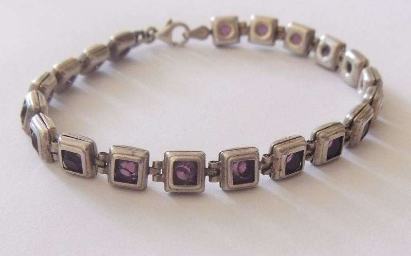 A GORGEOUS VINTAGE STERLING SILVER BRACELET SET WITH FACETED PURPLE STONES !! HINGED !! MUST HAVE !!