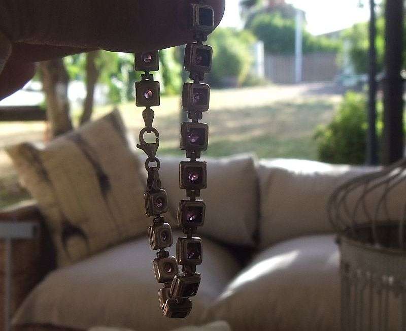A GORGEOUS VINTAGE STERLING SILVER BRACELET SET WITH FACETED PURPLE STONES !! HINGED !! MUST HAVE !!