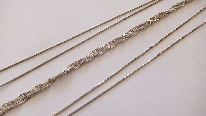 WOW !! THREE STERLING SILVER NECKLACES WITH THREE STERLING SILVER CROSS PENDANTS !! BID FOR THE LOT