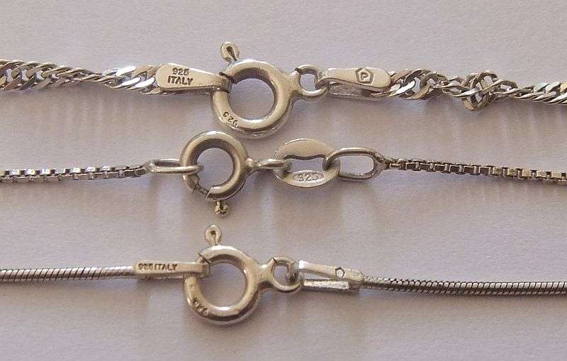 WOW !! THREE STERLING SILVER NECKLACES WITH THREE STERLING SILVER CROSS PENDANTS !! BID FOR THE LOT