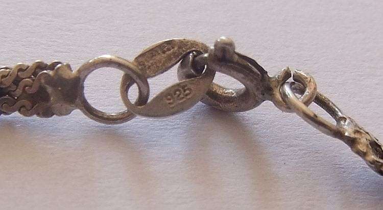 A STYLISH STERLING SILVER NECKLACE WITH A STERLING SILVER CROSS PLUS 3 STERLING SILVER RINGS !! WOW