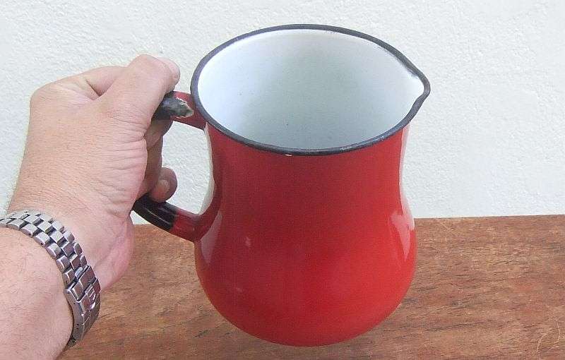 AN EYE CATCHING RARE VINTAGE RED ENAMEL WATER JUG