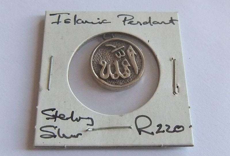 A SOLID STERLING SILVER ISLAMIC PENDANT