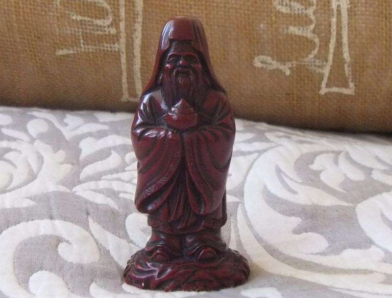 A DETAILED FIGURE OF AN ORIENTAL WISE MAN OR DEITY