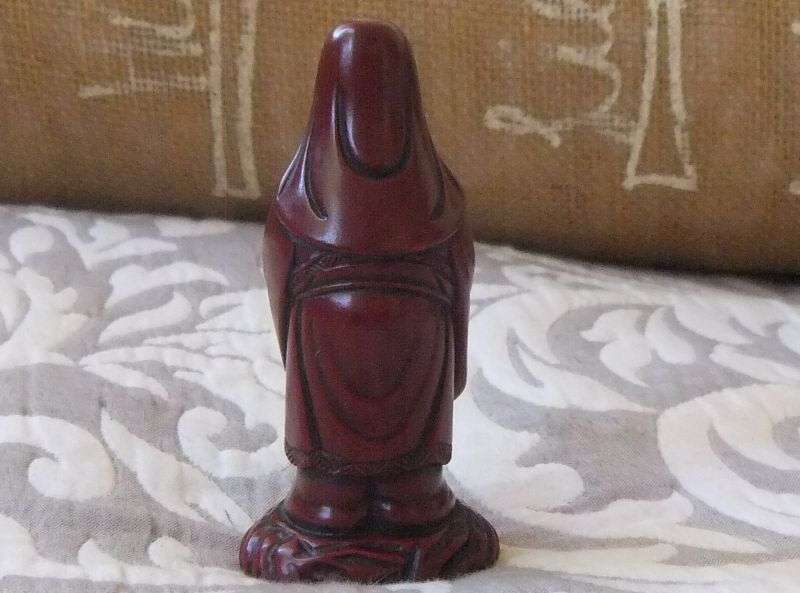 A DETAILED FIGURE OF AN ORIENTAL WISE MAN OR DEITY