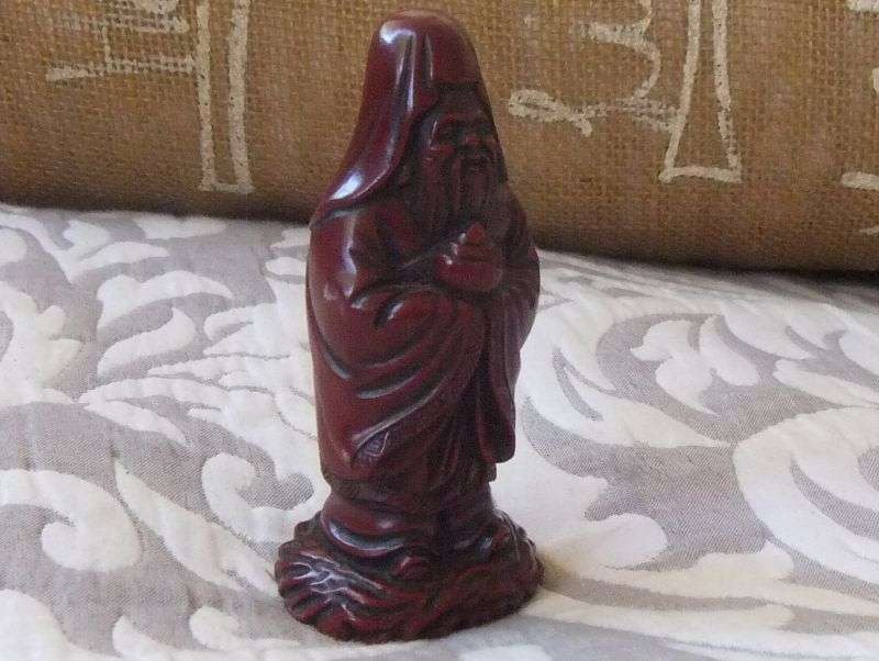 A DETAILED FIGURE OF AN ORIENTAL WISE MAN OR DEITY