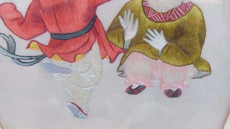 AN EYE CATCHING VINTAGE CHINESE EMBROIDERY...POSSIBLY SILK... FINE DETAIL WITH CHINESE CHARACTERS