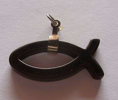 A FISH PENDANT MADE OF STONE