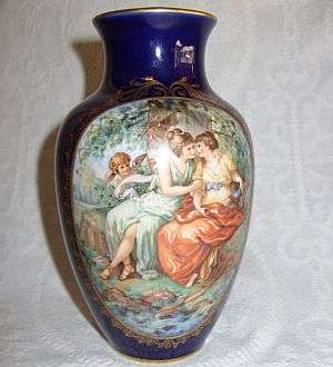 A cobalt blue Limoges vase with accentuated hand painted detail