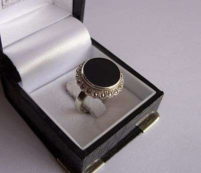 A BIG & BOLD STERLING SILVER RING SET WITH ONYX & MARCASITE