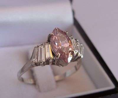 A LOVELY STERLING SILVER RING SET WITH FACETED STONES - KUNZITE / PINK TOPAZ ?