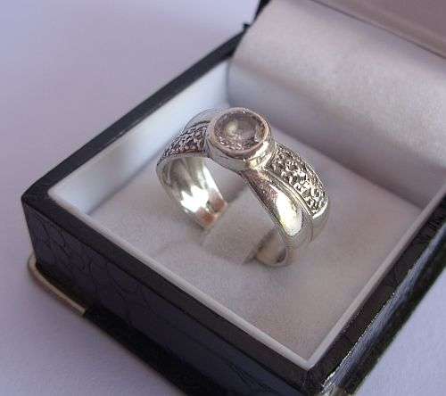 A SUPER QUALITY SOLID STERLING SILVER RING SET WITH 17 FACETED CZ STONES !!!