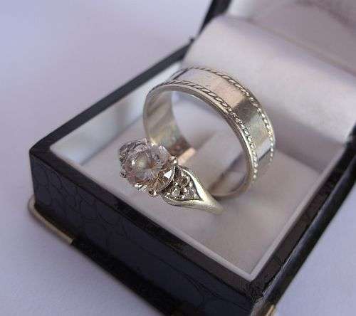 A BEAUTIFUL DUO !! TWO SOLID STERLING SILVER RINGS - ONE SET WITH FACETED CZ STONES !!!