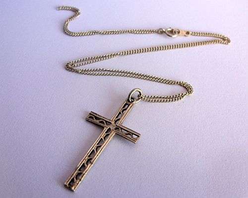 A STERLING SILVER NECKLACE WITH A STERLING SILVER CROSS PENDANT !!