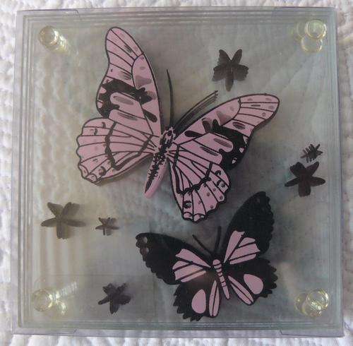 Set of glass coasters with butterfly print.  new and unopened.