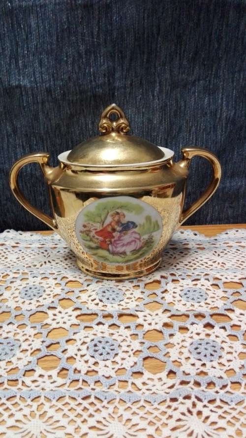 Unity teapot, sugar bowl, milk jug. Gilt with Victorian couple picture