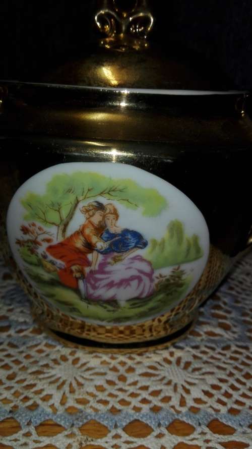 Unity teapot, sugar bowl, milk jug. Gilt with Victorian couple picture