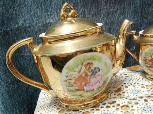 Unity teapot, sugar bowl, milk jug. Gilt with Victorian couple picture