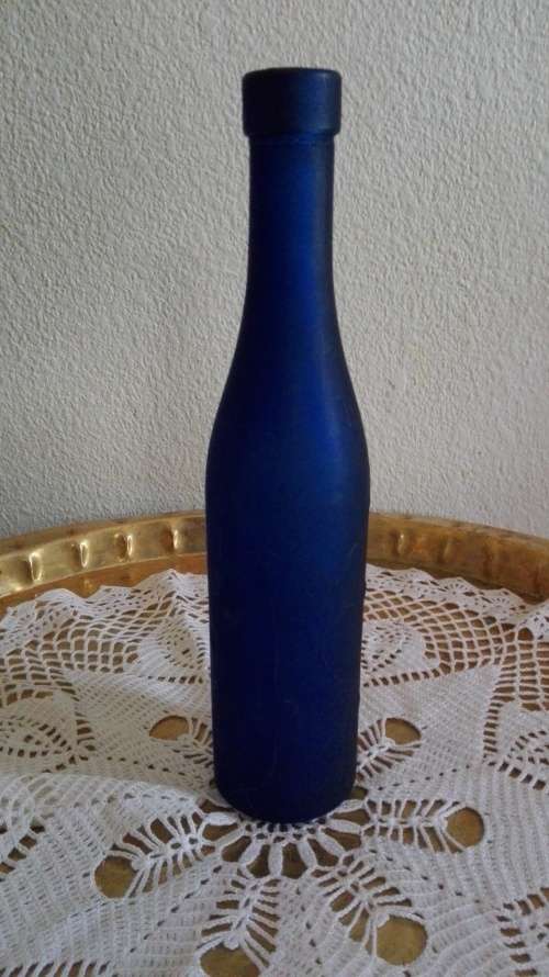 Frosted blue glass bottle