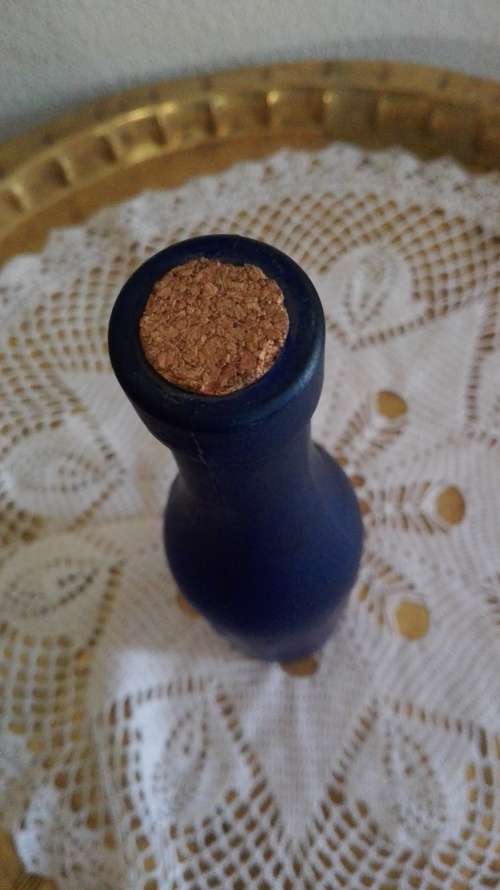 Frosted blue glass bottle