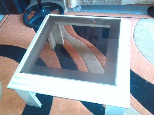 Glass topped coffee table