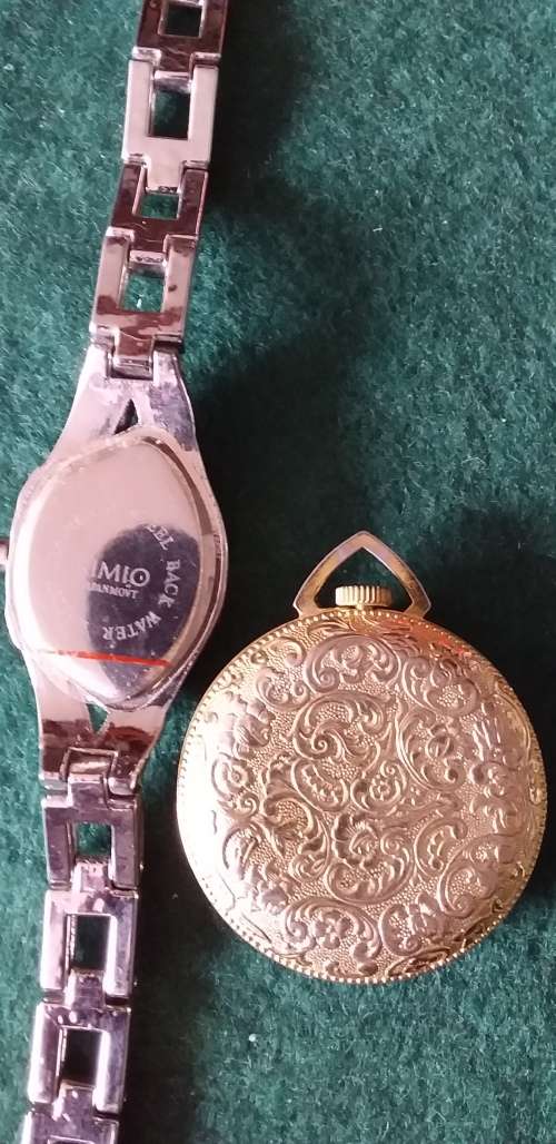 A Ladies Silver Tone Wrist Watch And A Gold Tone Pendant Watch - (Not Working)