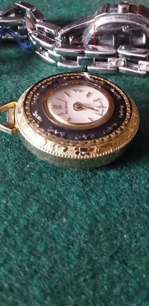 A Ladies Silver Tone Wrist Watch And A Gold Tone Pendant Watch - (Not Working)