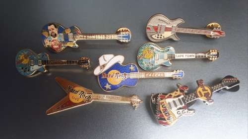 Hard Rock Cafe Guitar pins x 6 plus one other rock guitar