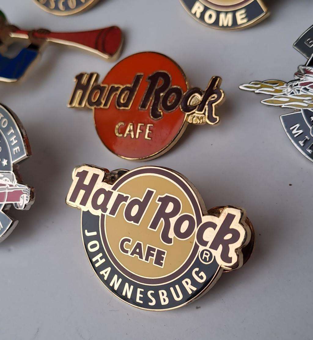 Hard Rock Cafe vintage pin badges  7 in total, one being the classic old style Hard Rock logo