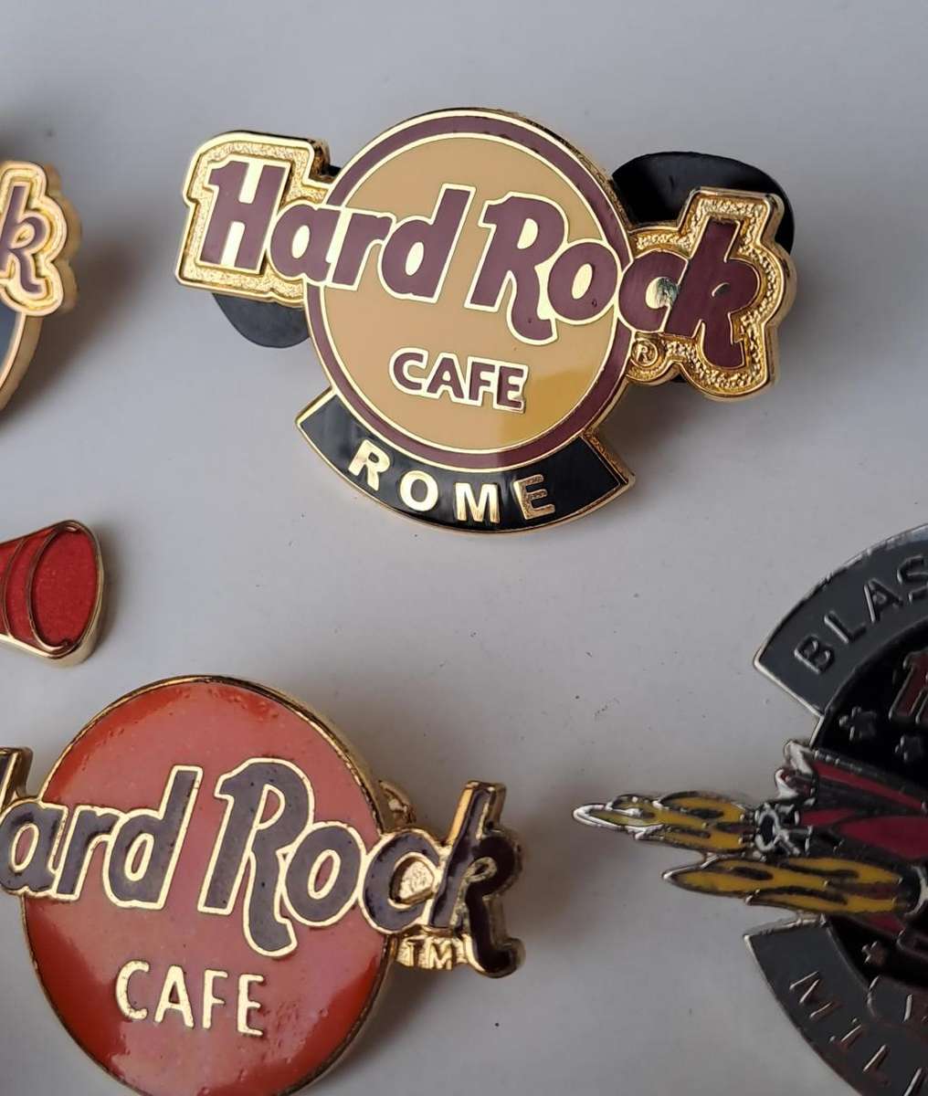 Hard Rock Cafe vintage pin badges  7 in total, one being the classic old style Hard Rock logo