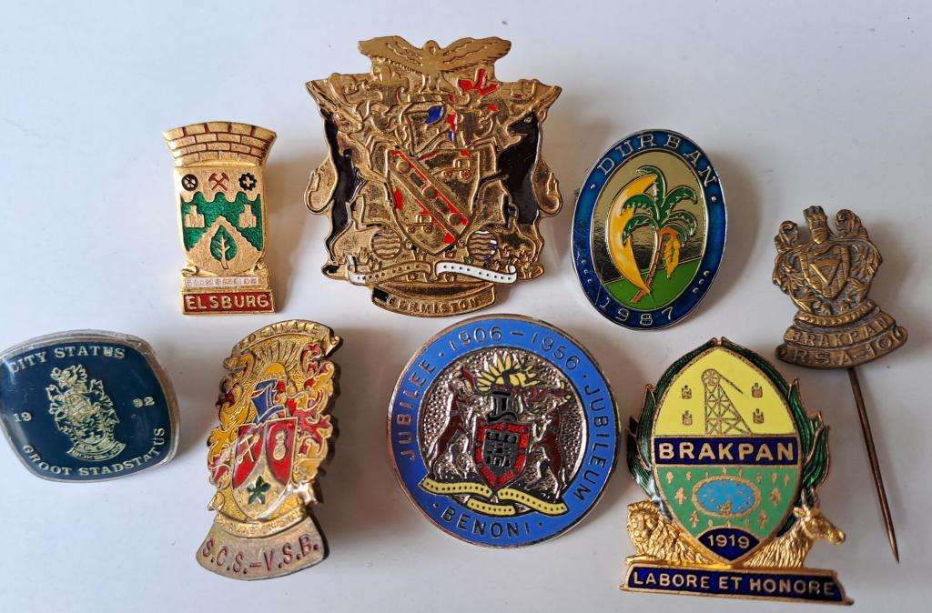 South African Historical pin badges of cities and towns eg: Benoni, Brakpan, Edenvale, etc. 8 badges