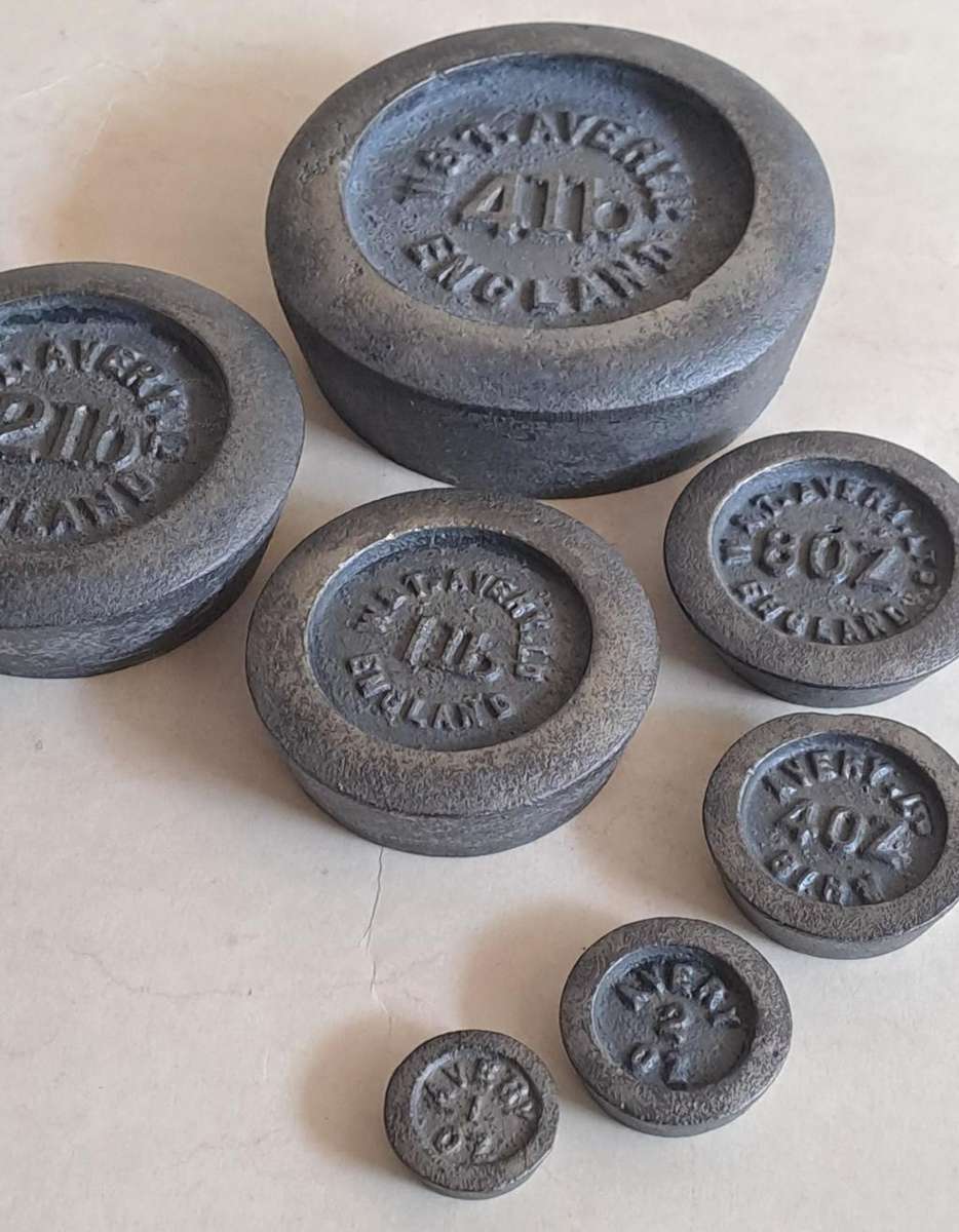 Antique cast-iron imperial weights as used in old home kitchens and grocery stores