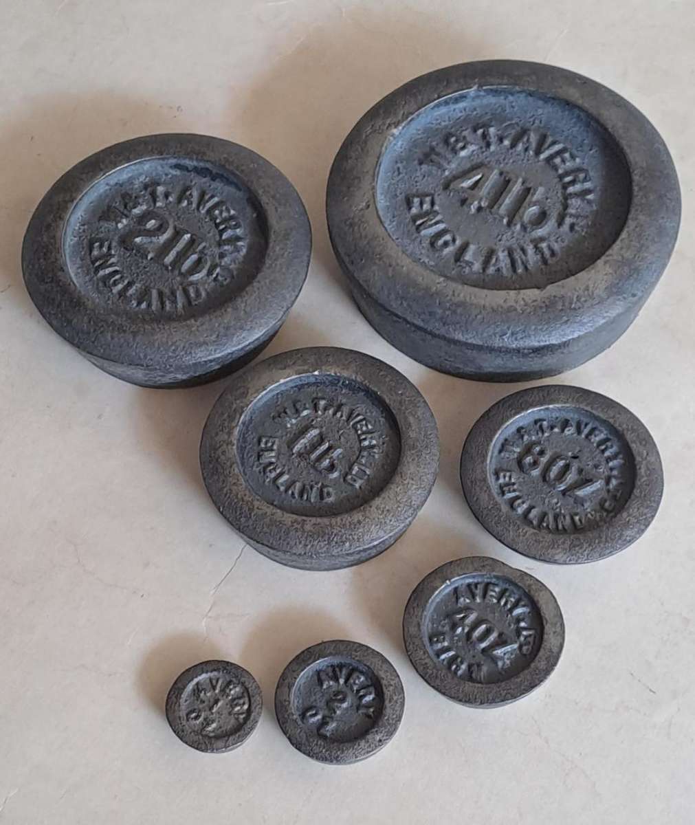 Antique cast-iron imperial weights as used in old home kitchens and grocery stores