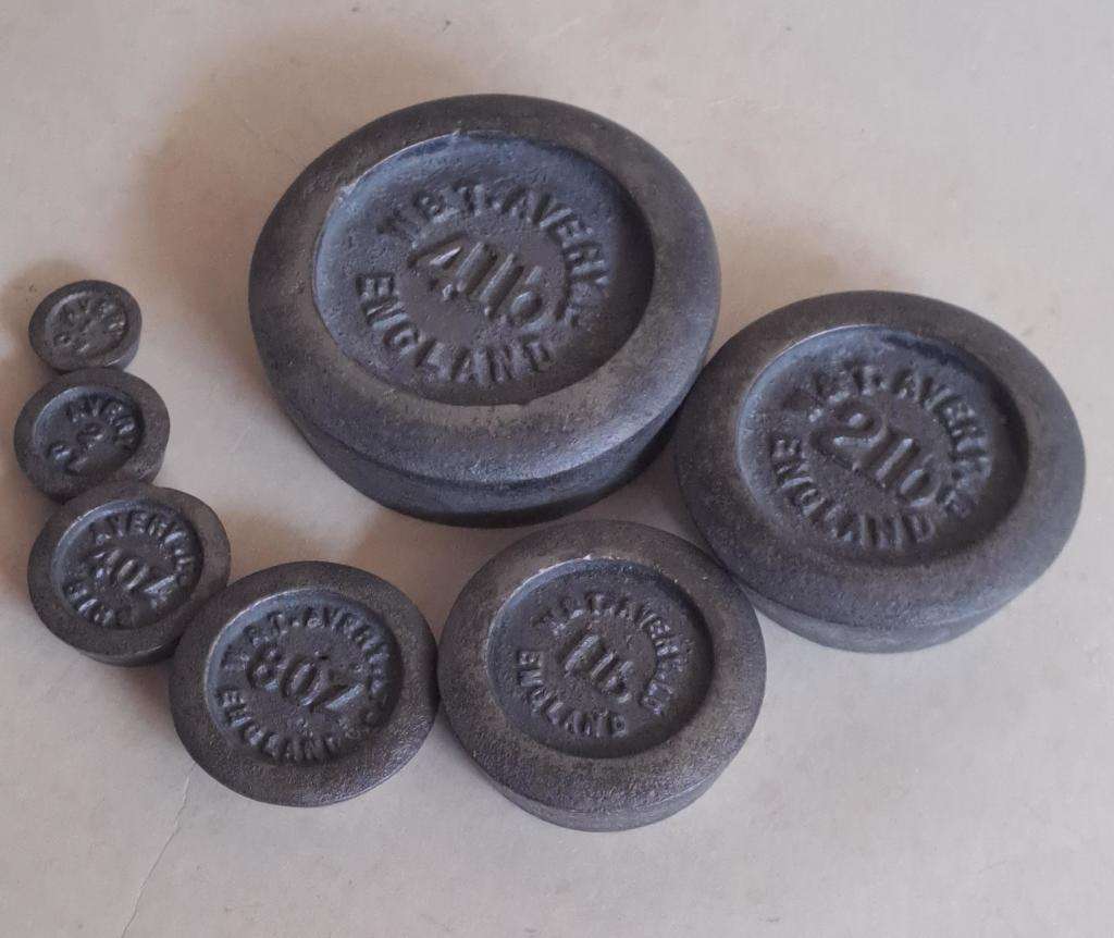 Antique cast-iron imperial weights as used in old home kitchens and grocery stores