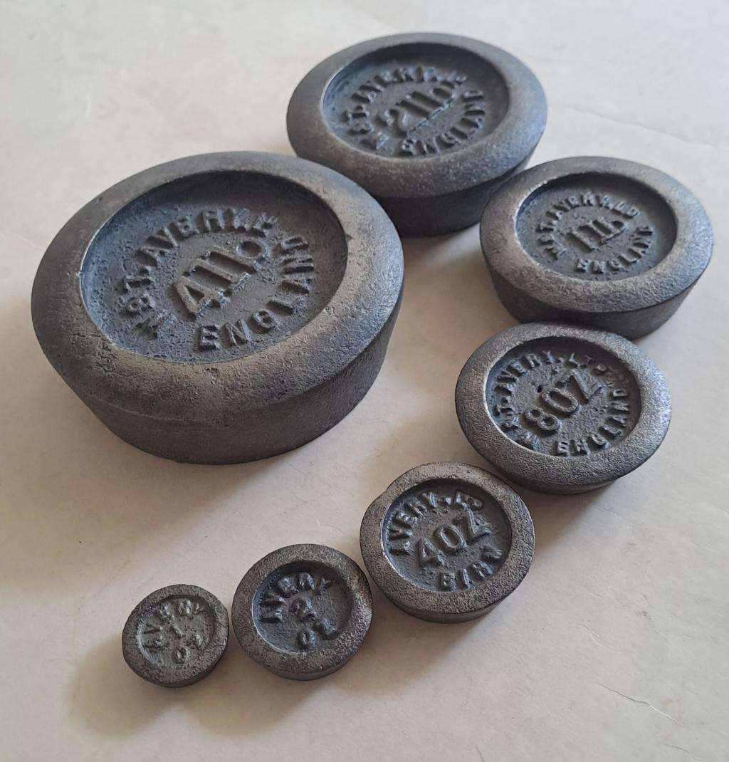 Antique cast-iron imperial weights as used in old home kitchens and grocery stores