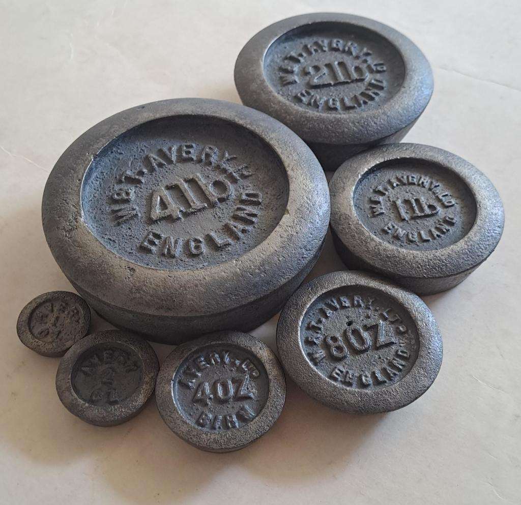 Antique cast-iron imperial weights as used in old home kitchens and grocery stores