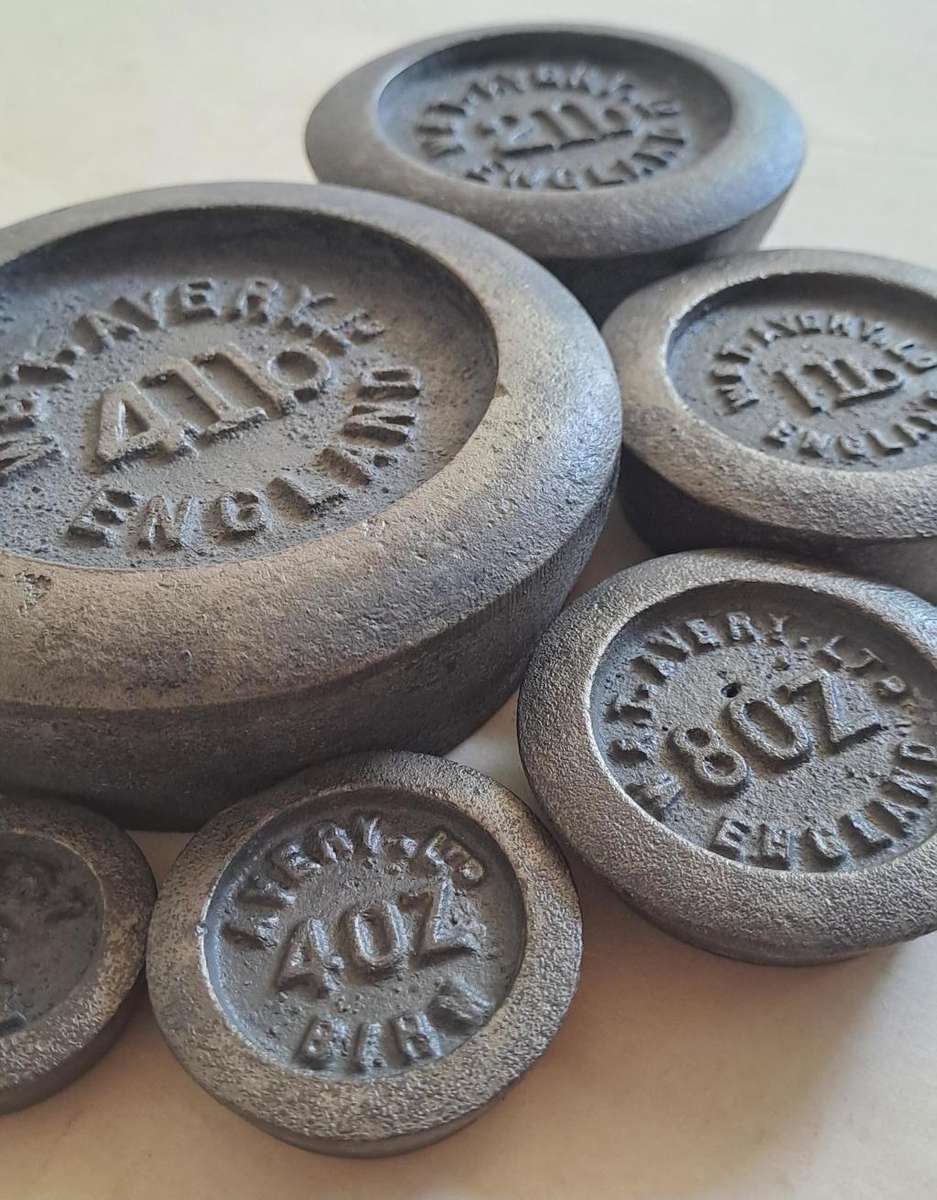 Antique cast-iron imperial weights as used in old home kitchens and grocery stores