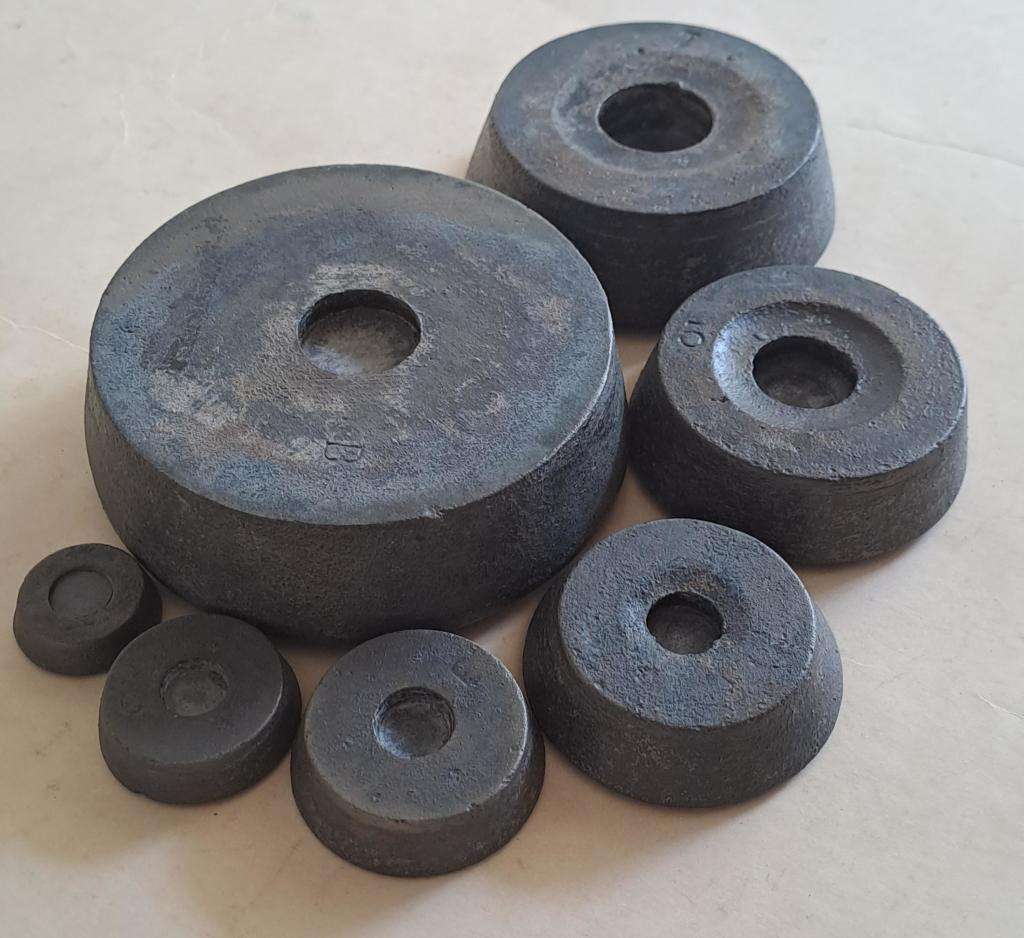 Antique cast-iron imperial weights as used in old home kitchens and grocery stores
