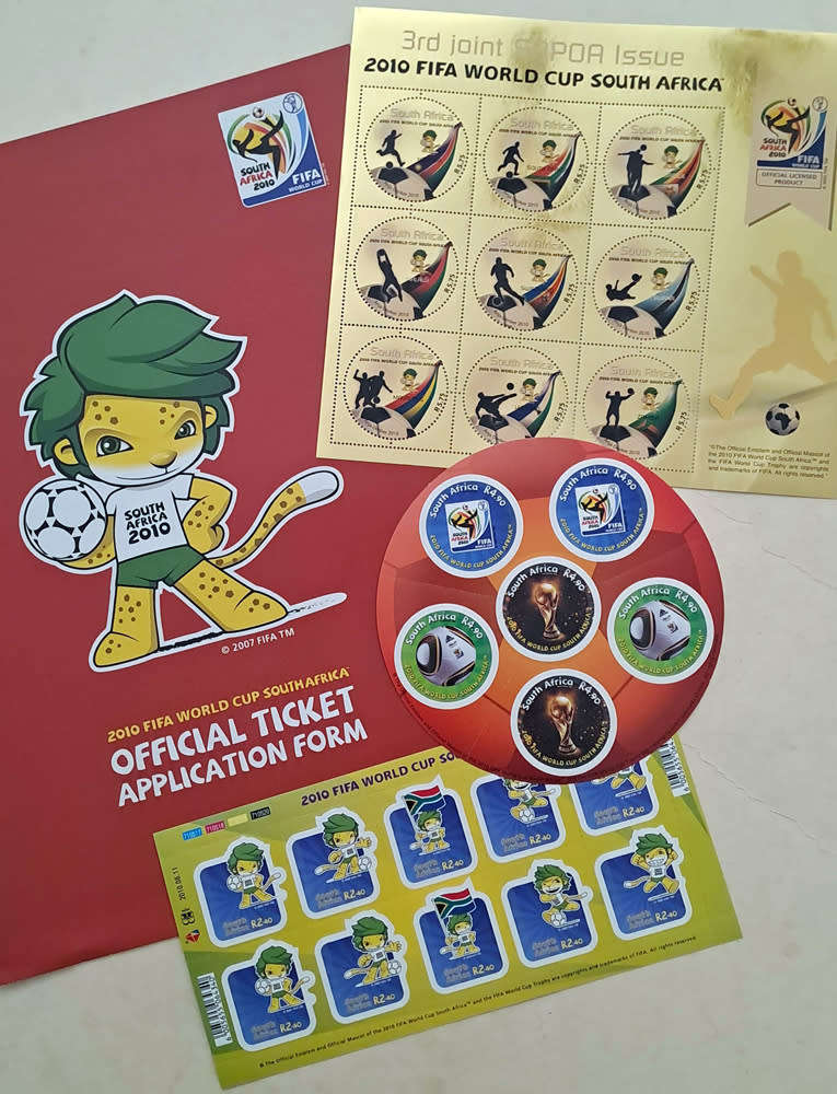FIFA World Cup Tournament brochures and 2010 Final Programmes with Zakumi mascot and pin badge
