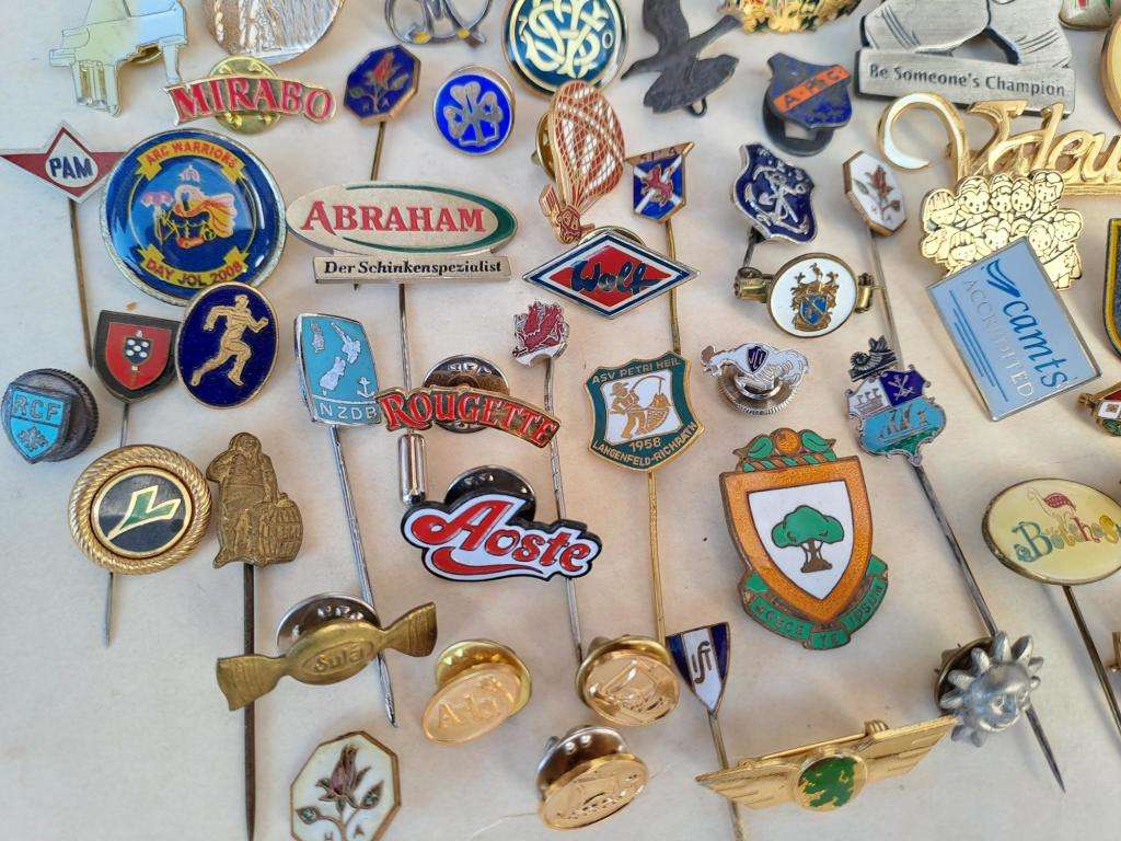 100 pin badges in all sizes and subject matter