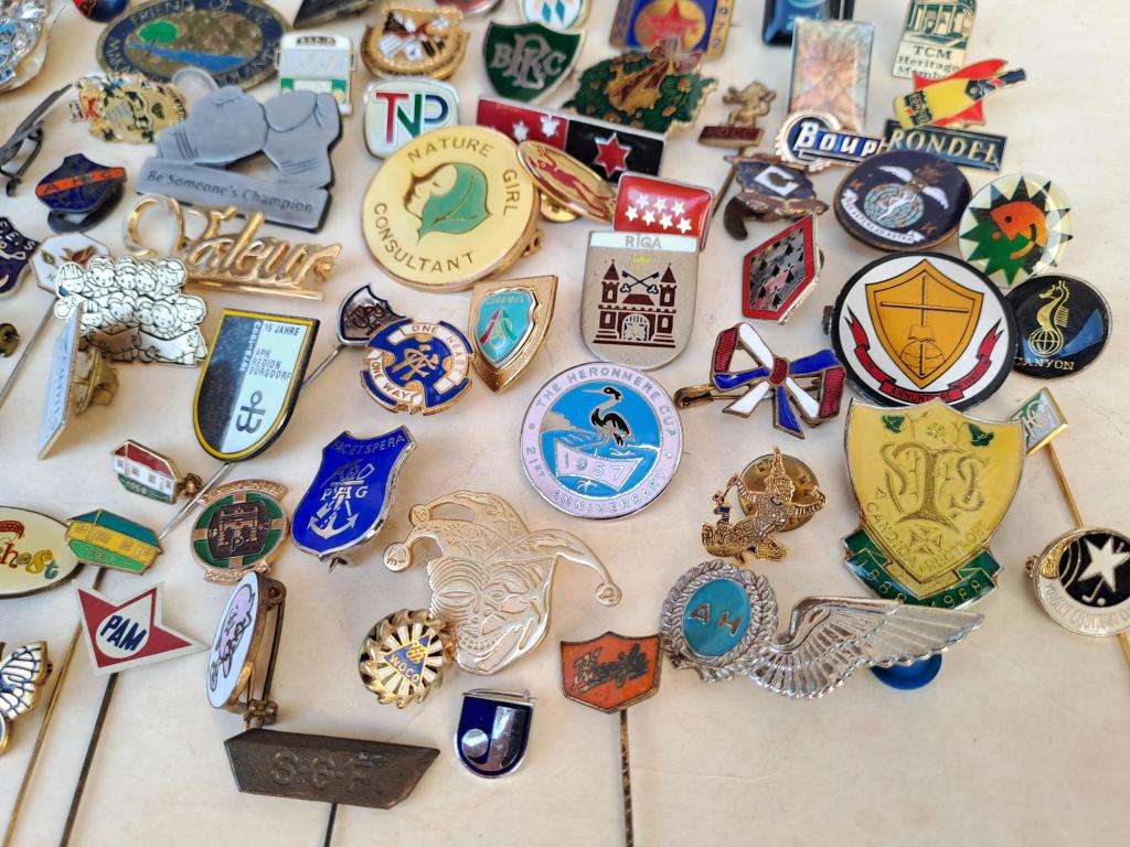100 pin badges in all sizes and subject matter