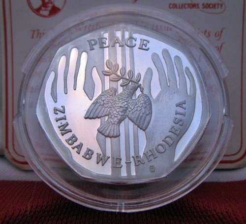 ## Zimbabwe-Rhodesia Silver Peace Medallion with COA in Red Livingstone Mint Box ##
