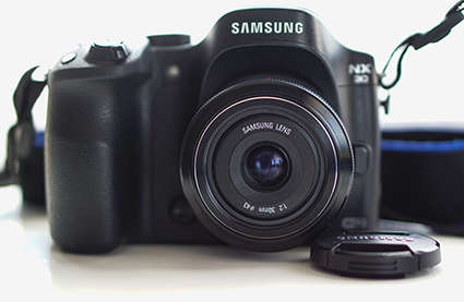 Samsung NX30 Mirrorless Camera + 30mm f/2 lens. Boxed. 4 Batteries and External Charger.