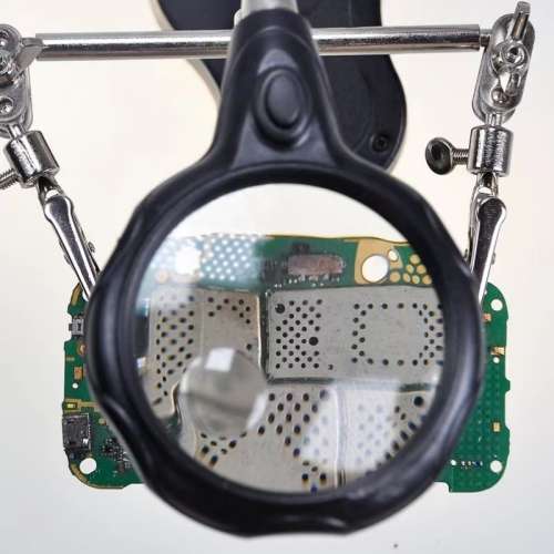 Digital Equipment Repair Tool. Magnifying Glass With Soldering Station