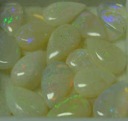 Incredible .60 ctw each Genuine White Opal with Pear Shape and Cabochon cut, 7x5 mm each