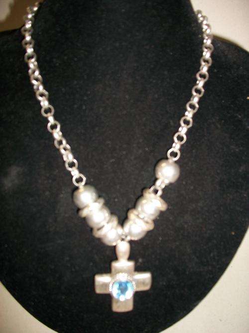 Plated silver necklace with light blue cross