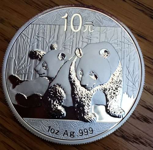 CHINA - 2010 UNC 10 YUAN SILVER PANDA, ONE OUNCE 0,999 SILVER. IN CAPSULE.