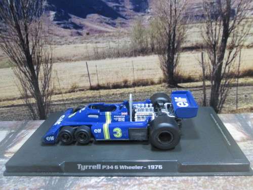 ATLAS / IXO  - 1976  TYRRELL P34  6 WHEELER    `JODY SCHECKTER `   ` MINT - BOX AND DISPLAY CASE
