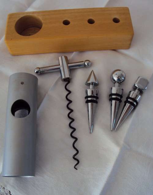 Set of 3 solid bottle stops and cork screw on wooden holder - good quality