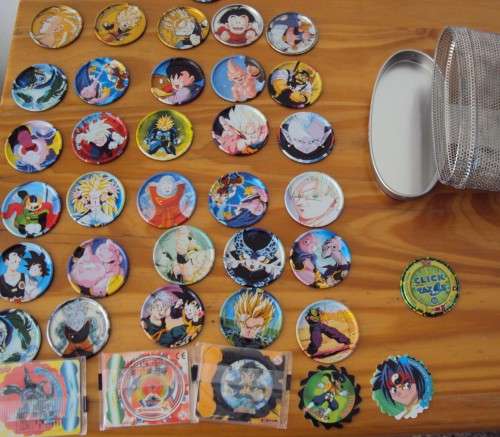 Tazos collection metal dragon & silver & gold in a metal mesh tin plus some other type still sealed